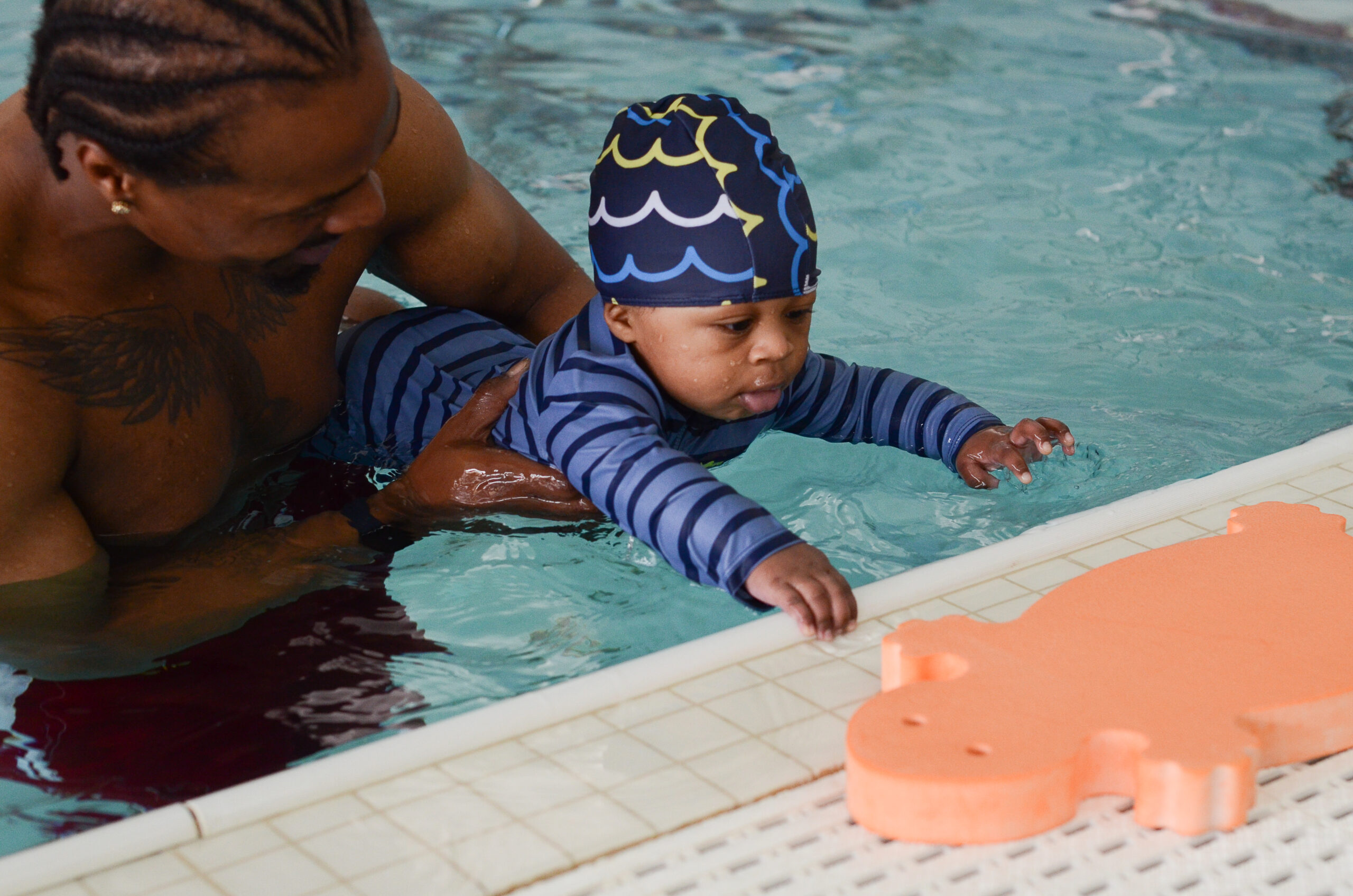 Otter baby and you swim classes at litter otter, parents in the pool with their babies learning swim skills, essential safety skills