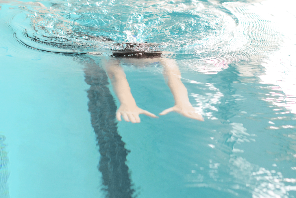 Stroke Proficiency photo of child moving under water doing breaststroke