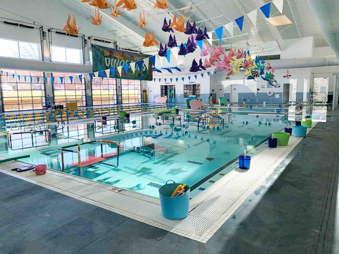 Indoor heated pool with colorful fish decor and kids swim activity area in Charlotte & Huntersville